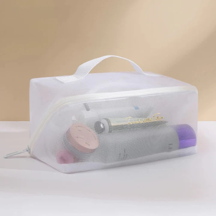 une trousse de toilette transparente Blanche